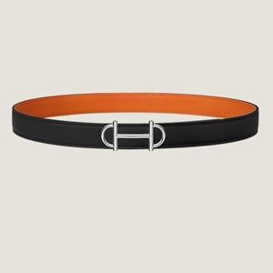 Hermes In Store Now Black and Orange Reversible belt with silver belt buckle.